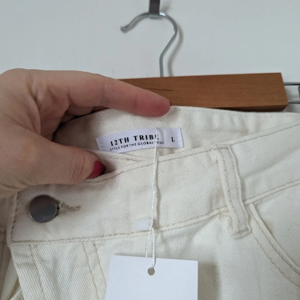 NWT‎ 12th Tribe bone off white ivory asymmetric crisscross Dylan denim shorts
